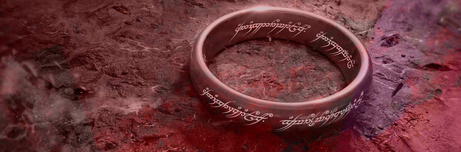 Ilustración. Sobre un fondo que simula una textura rocosa con tonos rojos y oscuros, se destaca un anillo dorado con inscripciones luminosas en un lenguaje antiguo.