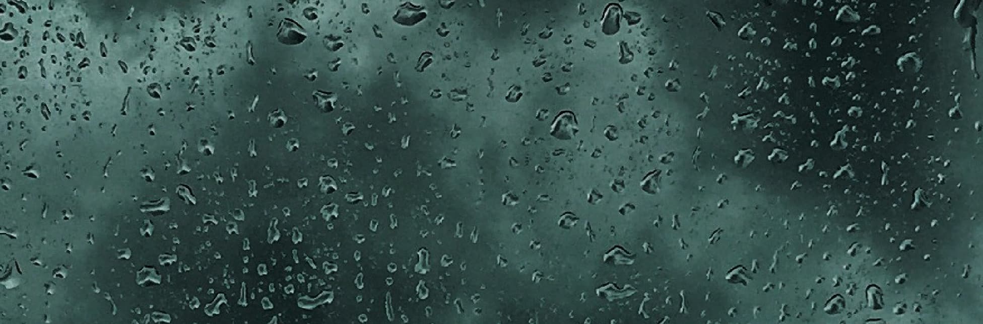Fotografía. Un fondo gris azulado cubierto de gotas de agua.