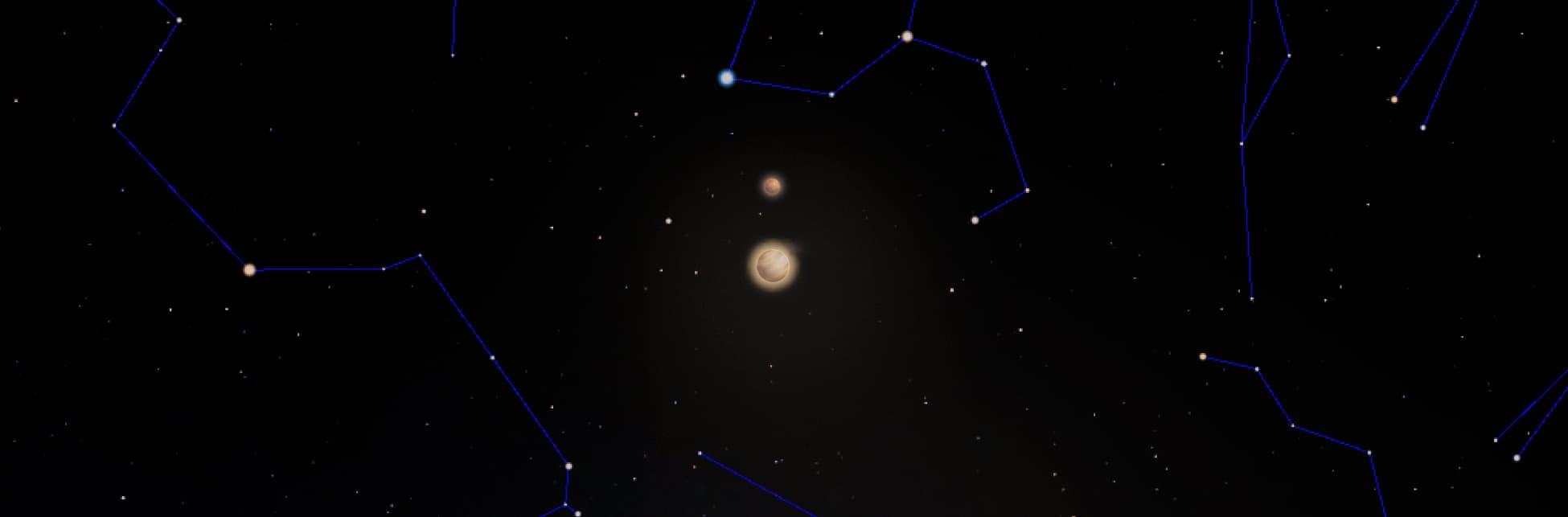 Foto. En el centro de la imagen dos círculos brillantes, uno más grande que el otro. Al rededor varios asterismos de constelaciones unidos por líneas color azul.