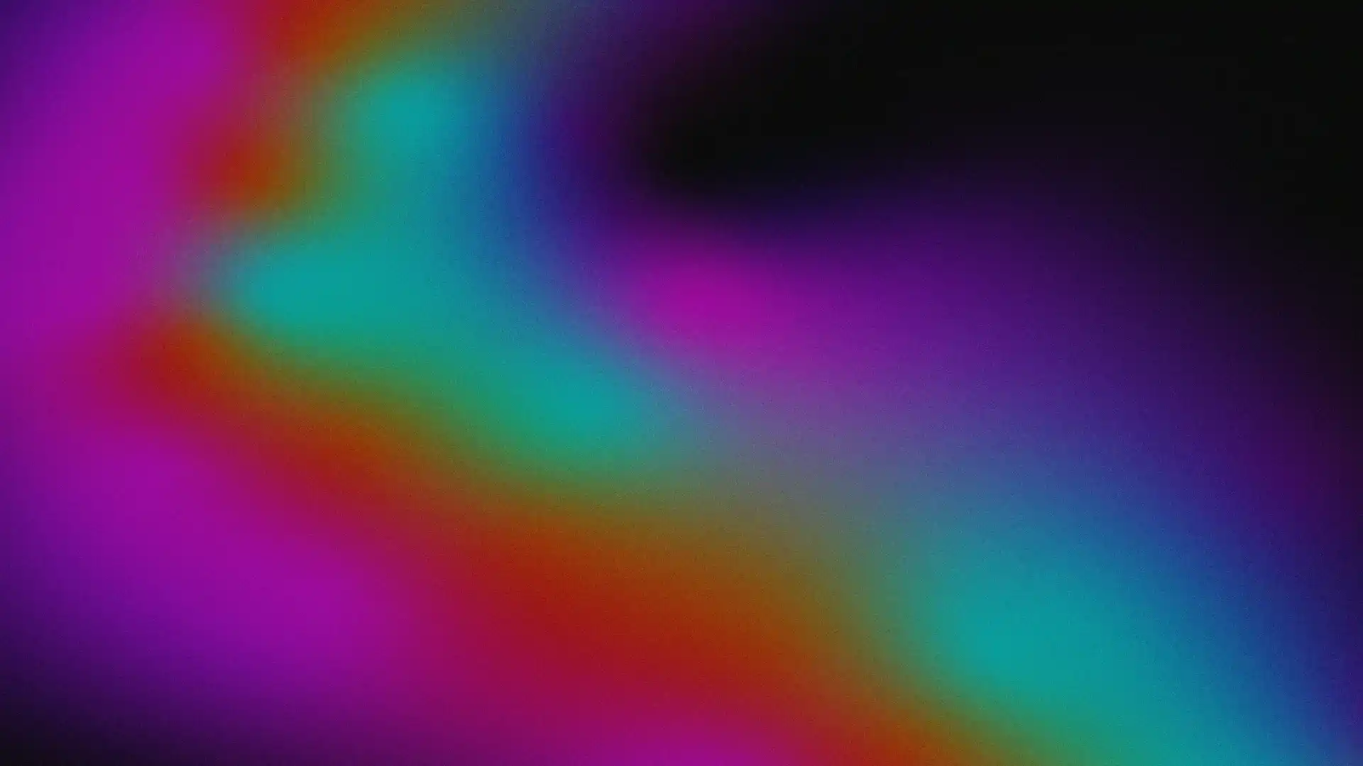 Ilustración abstracta. Sobre un fondo oscuro se despliegan formas difusas con apariencia de luces o nubes de color que se mezclan entre sí. Desde el lado izquierdo emerge una amplia franja luminosa que atraviesa la composición en diagonal hacia la parte inferior derecha, con transiciones suaves entre tonos magenta, violeta, rojo, naranja, verde turquesa y azul. En el centro se distinguen dos manchas luminosas de forma irregular: una más grande hacia la izquierda y otra más pequeña hacia la derecha. La imagen presenta un efecto de desenfoque y degradado continuo.