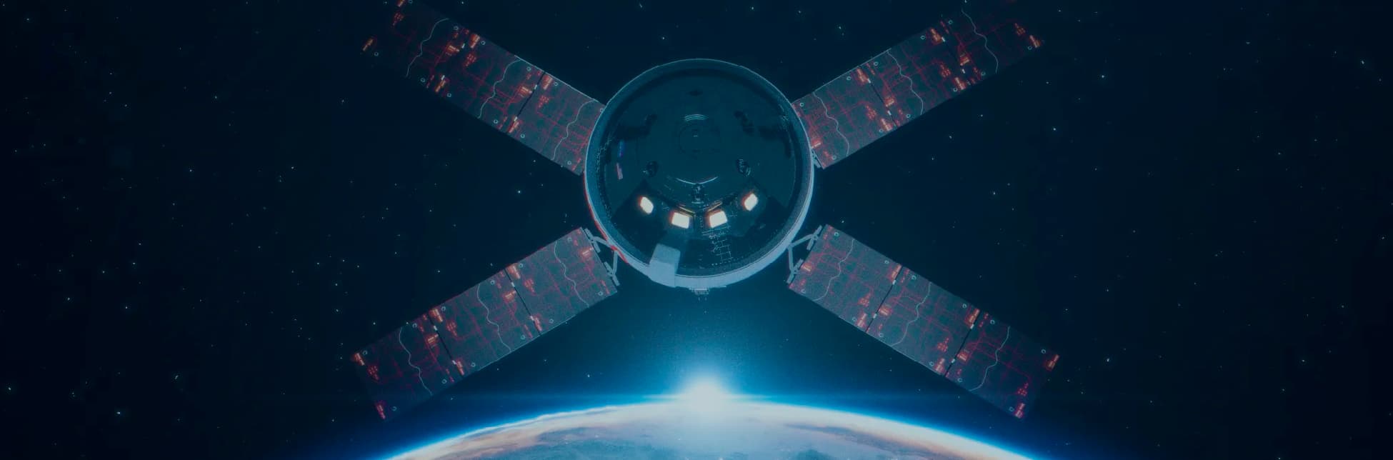 Foto. Sobre un fondo oscuro con estrellas y la curvatura iluminada de la Tierra se ve una nave espacial.