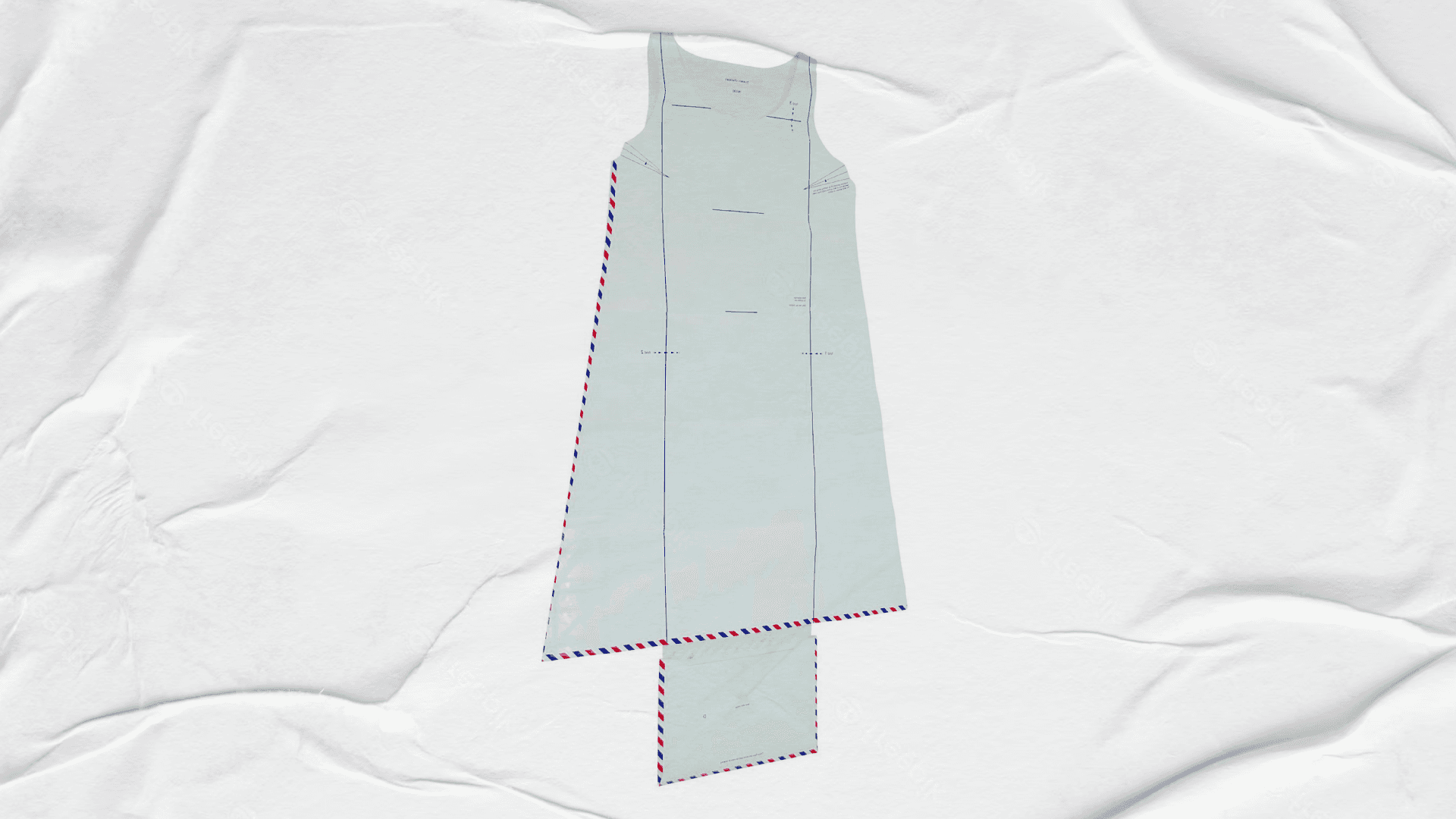 Fotografía. En el centro de la imagen un vestido hecho con cartas sobre un fondo de papel.